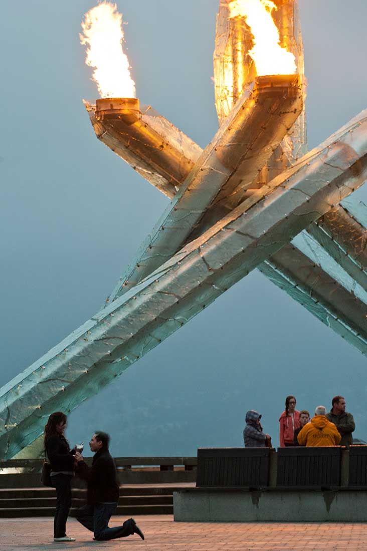 Proposal in front of Olympic Torch
